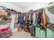 This walk-in closet features ample storage with shelves, hanging racks, and room for suitcases at 3135 Ellenton Dr, Lithia Springs, GA 30122