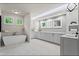 Luxurious bathroom with a soaking tub, double vanity, marble floors, and modern fixtures with lots of natural light at 340 Colewood Way, Atlanta, GA 30328