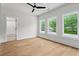 Bright bedroom with hardwood floors and large windows overlooking lush greenery at 340 Colewood Way, Atlanta, GA 30328