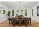 Dining room featuring hardwood floors, a modern chandelier, large windows, and seating for eight at 340 Colewood Way, Atlanta, GA 30328