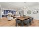 Spacious great room featuring hardwood floors, neutral decor, modern lighting, and an adjacent dining area and kitchen at 340 Colewood Way, Atlanta, GA 30328