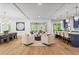 Spacious great room featuring hardwood floors, neutral decor, modern lighting, and an adjacent dining area and kitchen at 340 Colewood Way, Atlanta, GA 30328