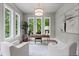 Sunlit home office with three large windows, neutral walls, modern lighting, and cozy white chairs at 340 Colewood Way, Atlanta, GA 30328