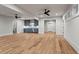 Finished basement living area with custom bar, hardwood flooring, and recessed lighting at 340 Colewood Way, Atlanta, GA 30328