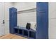 Functional mudroom with custom blue cabinetry, bench seating, and storage hooks for coats and accessories at 340 Colewood Way, Atlanta, GA 30328