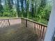 Wood deck showcasing a private backyard with lush trees, perfect for outdoor enjoyment at 3948 Valley Brook Rd, Snellville, GA 30039