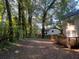 A spacious backyard with trees and a deck in a serene and wooded setting at 3948 Valley Brook Rd, Snellville, GA 30039