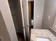 Well-lit bathroom showcasing an open closet and granite sink countertop at 3948 Valley Brook Rd, Snellville, GA 30039
