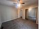 Cozy bedroom with fan, plush carpet and sliding mirrored door closet at 3948 Valley Brook Rd, Snellville, GA 30039