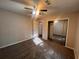 Cozy bedroom featuring a ceiling fan, closet with mirrored doors, and natural light from window at 3948 Valley Brook Rd, Snellville, GA 30039