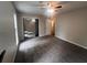 Spacious bedroom with plush carpet, ceiling fan, and closet with sliding doors at 3948 Valley Brook Rd, Snellville, GA 30039