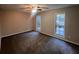 Bedroom featuring two windows that allow natural light to illuminate the carpeted floor at 3948 Valley Brook Rd, Snellville, GA 30039