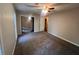 Neutral bedroom featuring a ceiling fan, carpeted floor and closet with mirrored sliding doors at 3948 Valley Brook Rd, Snellville, GA 30039