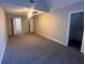 Bedroom featuring three entryways and carpeted floor at 3948 Valley Brook Rd, Snellville, GA 30039
