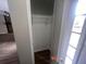A view through the door reveals a small closet and a view of the living room fireplace at 3948 Valley Brook Rd, Snellville, GA 30039