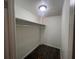 Neutral-toned closet offering efficient storage at 3948 Valley Brook Rd, Snellville, GA 30039