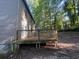 View of a wooden deck with railing, perfect for outdoor entertaining, overlooking the backyard at 3948 Valley Brook Rd, Snellville, GA 30039