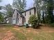 The exterior features include a siding and a lush, tree-filled surrounding landscape at 3948 Valley Brook Rd, Snellville, GA 30039