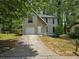 Charming two-story home with a one-car garage and front lawn at 3948 Valley Brook Rd, Snellville, GA 30039