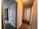 Hallway view with open doorway entrances and hard surface flooring at 3948 Valley Brook Rd, Snellville, GA 30039