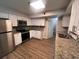 Updated kitchen featuring modern appliances, granite countertops, and mosaic backsplash at 3948 Valley Brook Rd, Snellville, GA 30039