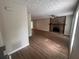 A spacious living room features new flooring and a stone fireplace as a focal point at 3948 Valley Brook Rd, Snellville, GA 30039