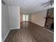 Open living room featuring wood-look flooring and doors to the yard at 3948 Valley Brook Rd, Snellville, GA 30039