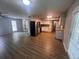 Open-concept kitchen and living room with stainless steel appliances and bright natural light at 3948 Valley Brook Rd, Snellville, GA 30039
