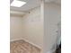 Unfinished basement space featuring neutral walls, vinyl flooring, and overhead lighting at 401 Farm Brook Ln, Dallas, GA 30157