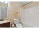 Bathroom boasts a shower-tub combination, a towel rack with a towel, and a vanity sink at 401 Farm Brook Ln, Dallas, GA 30157