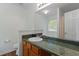 Bathroom featuring a vanity with granite countertops and modern fixtures at 401 Farm Brook Ln, Dallas, GA 30157