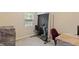 Bedroom with a stationary bike, furniture wrapped in plastic and a large window at 401 Farm Brook Ln, Dallas, GA 30157