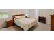 Comfortable bedroom with natural light, a dresser, and bedside tables at 401 Farm Brook Ln, Dallas, GA 30157