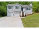 Charming home with a two-car garage and well-maintained lawn at 401 Farm Brook Ln, Dallas, GA 30157