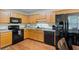 Kitchen with modern appliances and wood cabinets at 401 Farm Brook Ln, Dallas, GA 30157