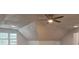 Spacious attic with plush carpet, recessed lighting, and a modern ceiling fan at 5621 Wildwood Trl, Lithonia, GA 30038