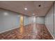 Finished basement area with recessed lighting, tiled floor, and doorway access to other rooms at 5621 Wildwood Trl, Lithonia, GA 30038