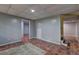 View of the finished basement featuring neutral walls and unique tile flooring at 5621 Wildwood Trl, Lithonia, GA 30038