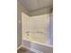 Bathroom features a shower and tub combo with white surround at 5621 Wildwood Trl, Lithonia, GA 30038