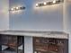 Bathroom boasts granite counters, with dual sinks and great lighting at 5621 Wildwood Trl, Lithonia, GA 30038