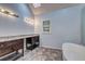 Bathroom boasts dual vanities, a soaker tub and a skylight for added lighting at 5621 Wildwood Trl, Lithonia, GA 30038
