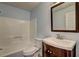 Bathroom with vanity, toilet, and shower-tub combo at 5621 Wildwood Trl, Lithonia, GA 30038