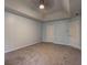 Spacious bedroom with light blue walls and neutral carpeting at 5621 Wildwood Trl, Lithonia, GA 30038