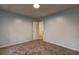 Bedroom with neutral carpet and light-blue walls at 5621 Wildwood Trl, Lithonia, GA 30038