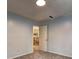Comfortable bedroom with plush carpet, ample natural light, and access to other rooms at 5621 Wildwood Trl, Lithonia, GA 30038