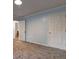 Bedroom showcasing soft carpet, light blue walls, and crisp, white doors at 5621 Wildwood Trl, Lithonia, GA 30038