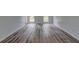 This bedroom features sleek, modern, wood-look flooring and neutral paint at 5621 Wildwood Trl, Lithonia, GA 30038