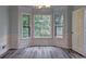 This dining room has beautiful trim work and lots of natural light from its large windows at 5621 Wildwood Trl, Lithonia, GA 30038