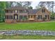 Charming brick home with black shutters, manicured landscaping, and a welcoming front entrance at 5621 Wildwood Trl, Lithonia, GA 30038