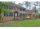 Charming home featuring manicured front lawn, brick exterior, and welcoming entry at 5621 Wildwood Trl, Lithonia, GA 30038